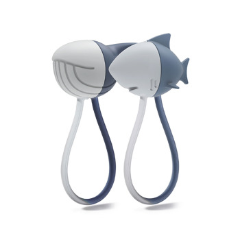 Magnetic cable wraps from Qualy. These fun magnets look like a shark and a whale. Use for collecting your wires.