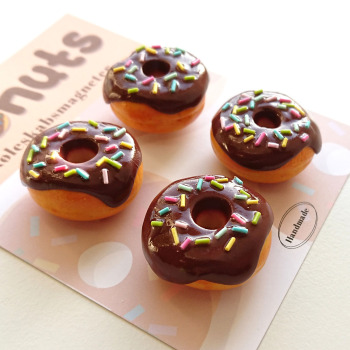 Cool and fun fridge magnets - looking just like 4 mini donuts. Keep away from small children as it is dangerous to swallow magnets.