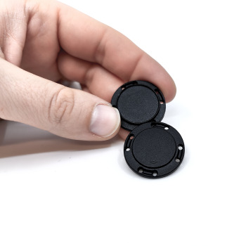Black button magnet for sewing into clothing and costumes - a set with two parts that attract with a strength of about 2.5 kg.